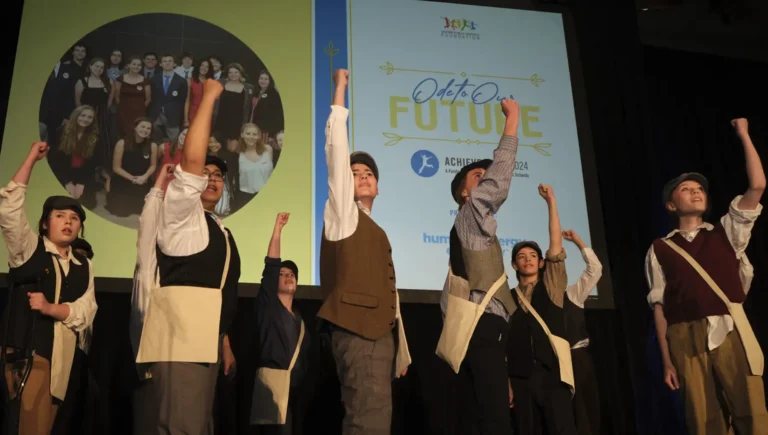 A group of students perform a number from Newsies at the 2024 Achieve Gala.